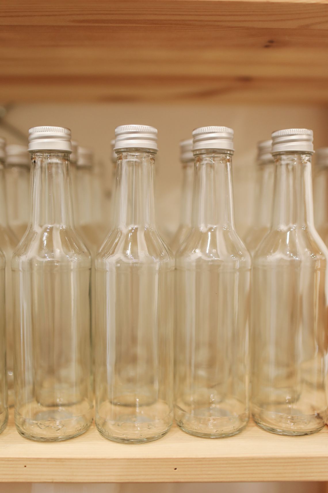 Reusable glass storage containers arranged neatly on a shelf