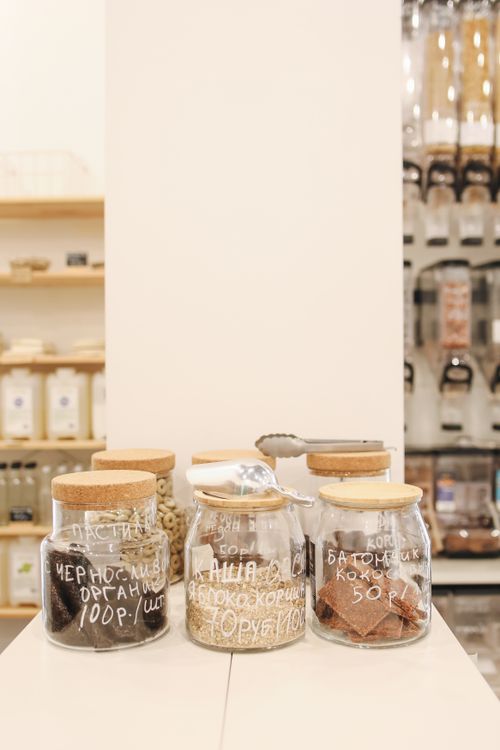 Free Explore a zero-waste store featuring diverse snacks in glass jars, promoting sustainable shopping. Stock Photo