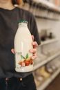Person Holding Bottle