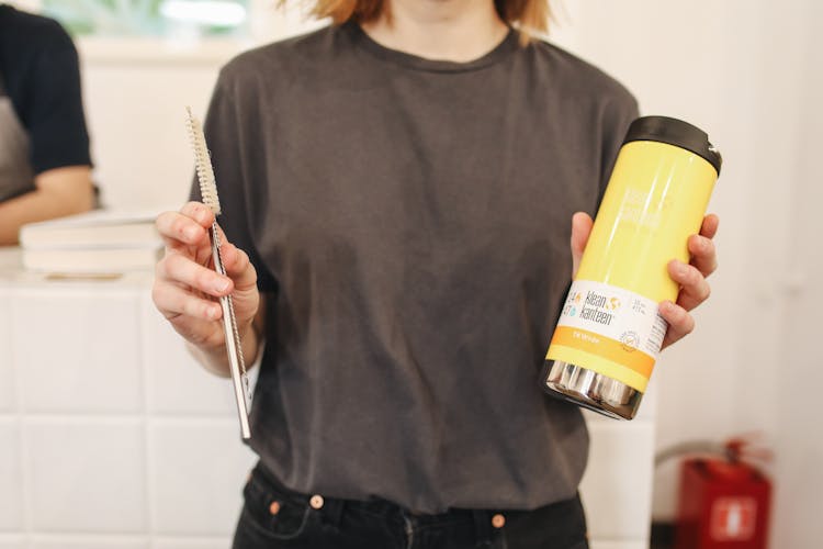 Woman Holding Thermos