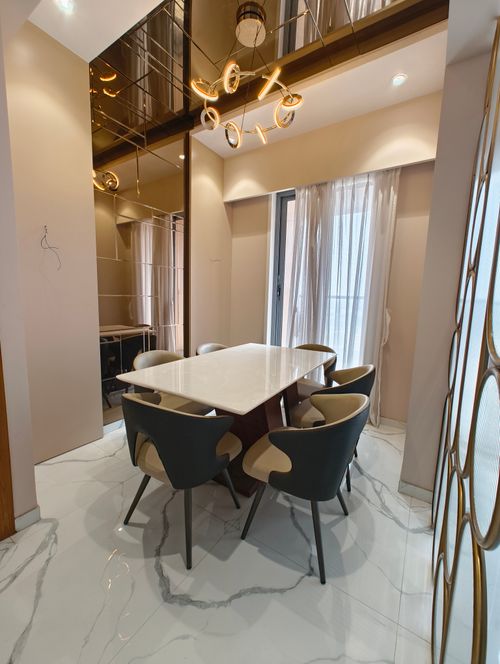 Free Stylish modern dining room with elegant furniture and lighting, perfect for contemporary homes. Stock Photo