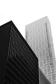 Black and white photo of modern skyscrapers in Melbourne's urban landscape.