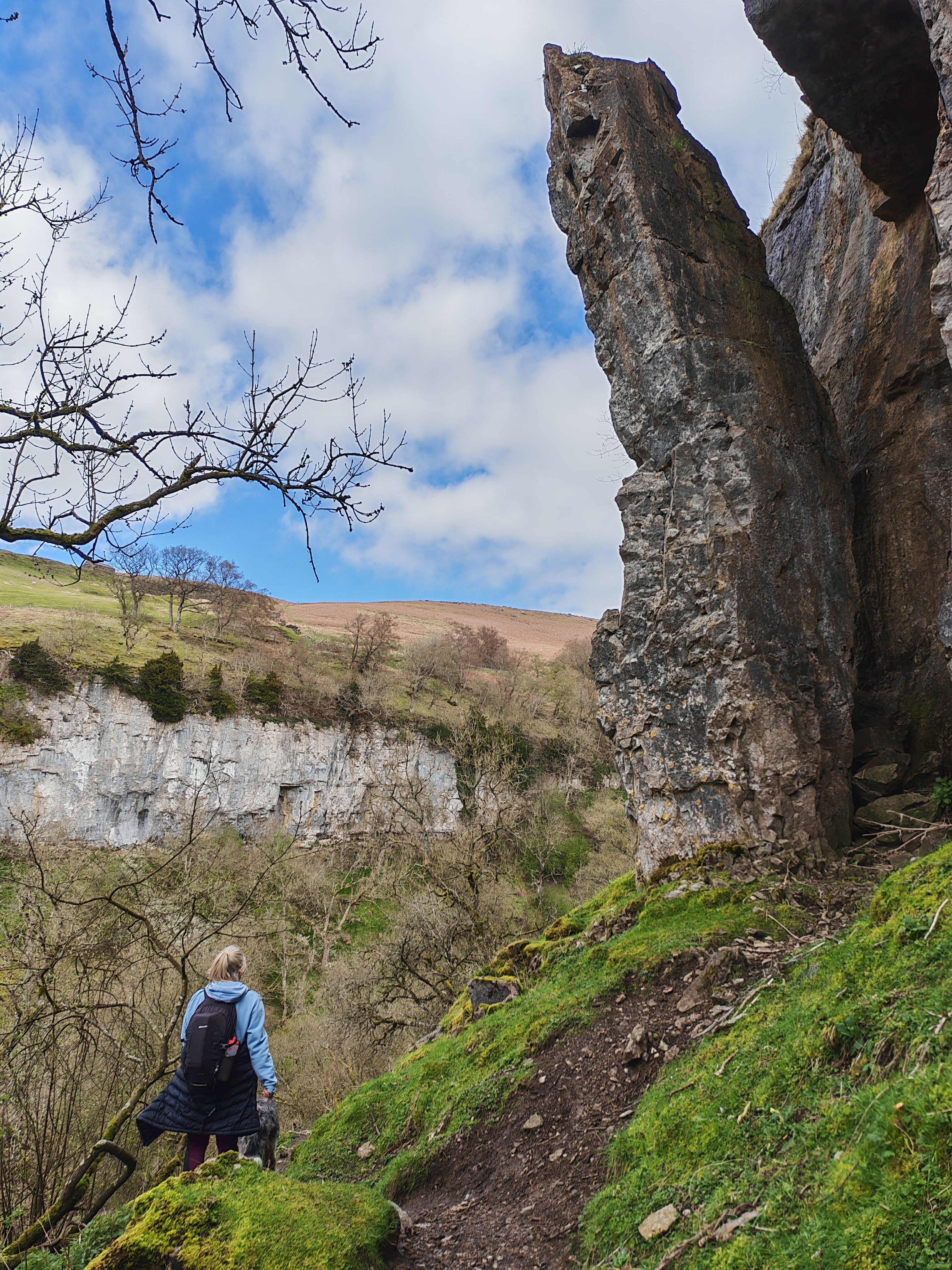 Hiker Exploring Scenic Limestone Cliff Pathway · Free Stock Photo