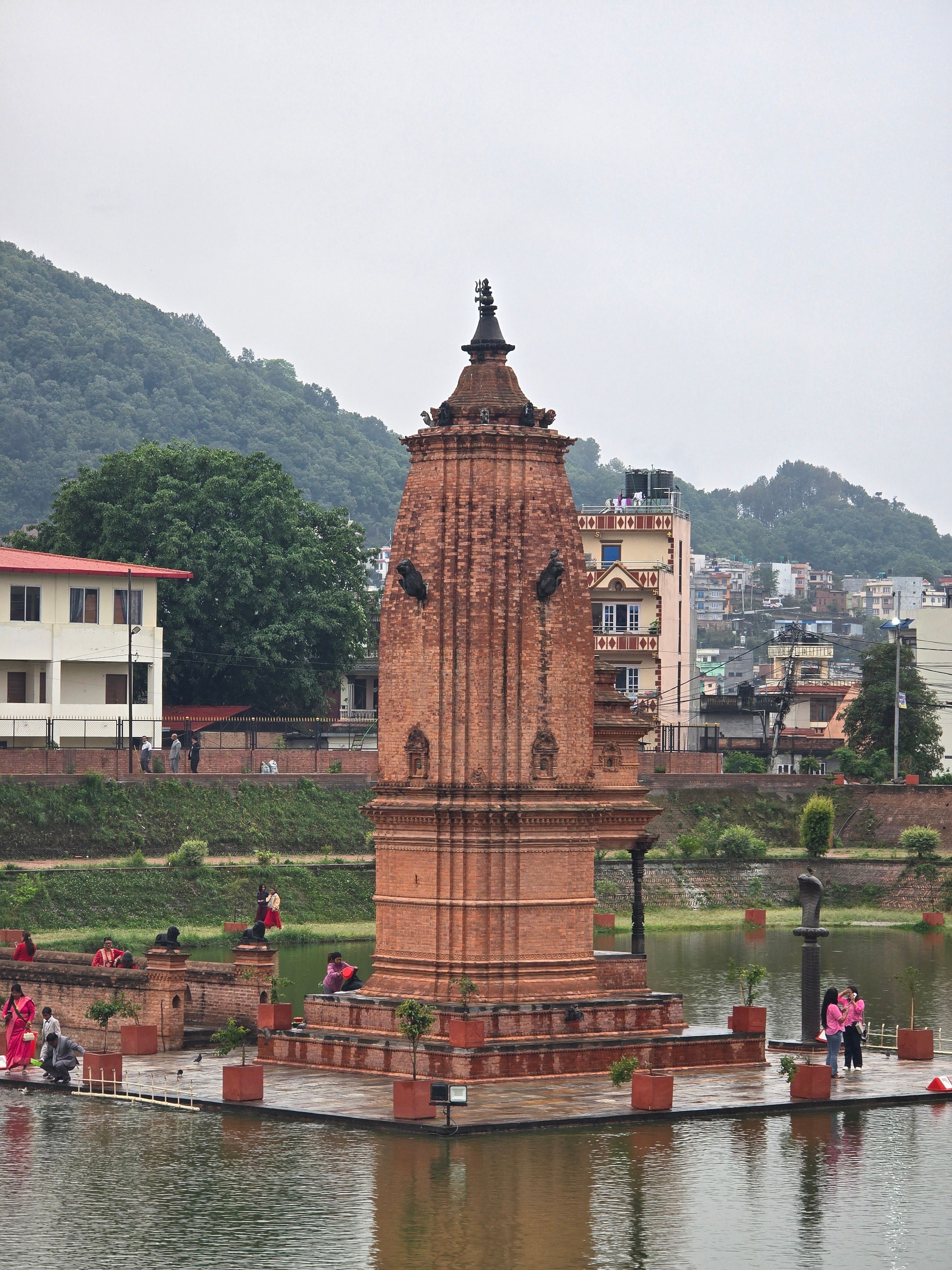 Scenic view of Kamal Pokhari with Bhimsen Temple reflecting in the pond, Kathmandu, Nepal.