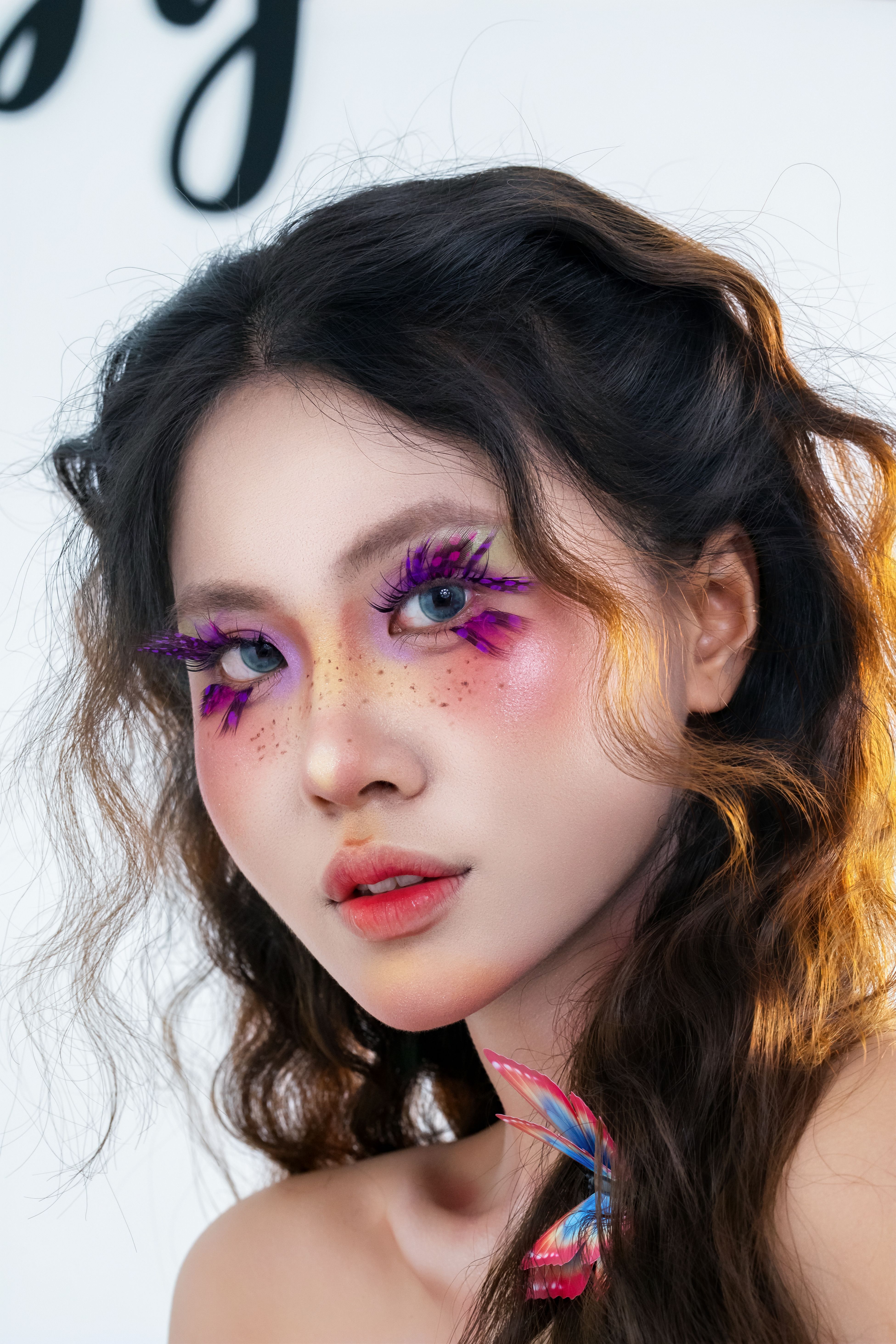 Creative Portrait with Vibrant Makeup and Accessories · Free Stock Photo