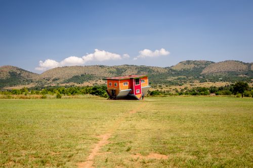 Free Unique upside down house on a sunny field in Hartbeespoort, South Africa. Stock Photo