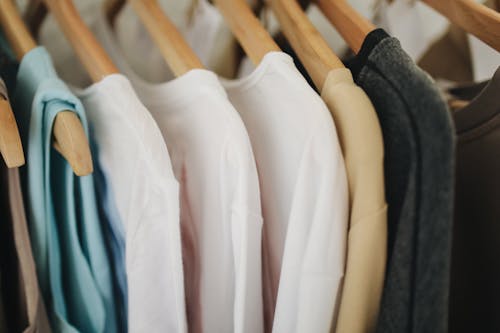 Free White Long Sleeves Shirts on Brown Wooden Clothes Hanger Stock Photo
