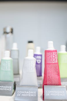 A variety of hand creams beautifully arranged on store shelves with focus on branding.