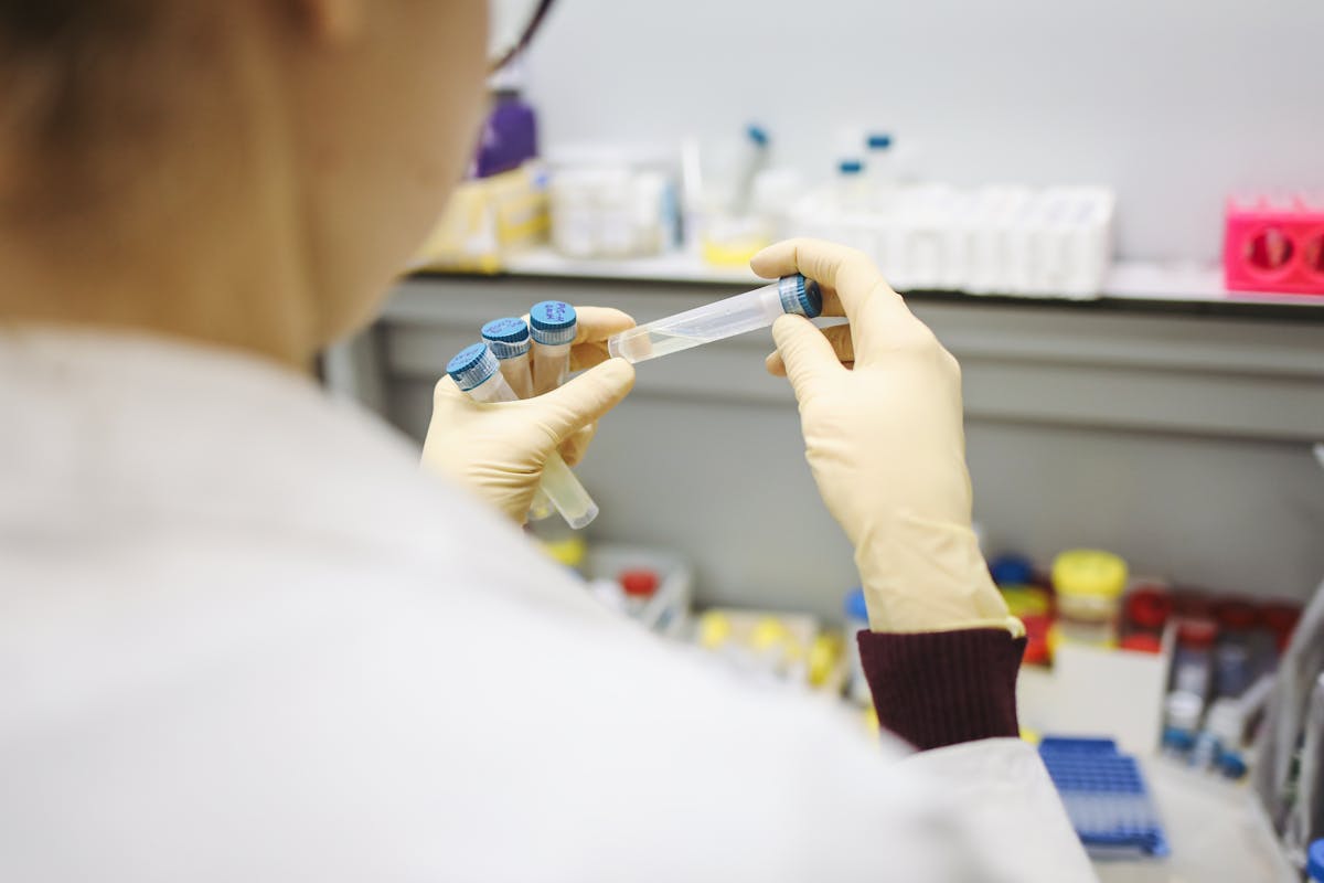 Laboratory technician analyzing oil samples under microscope