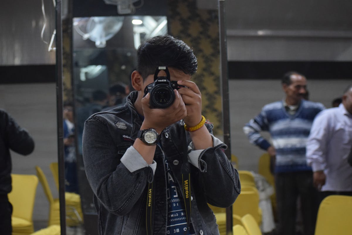 Older adult smiling while preparing vegetables in a bright kitchen