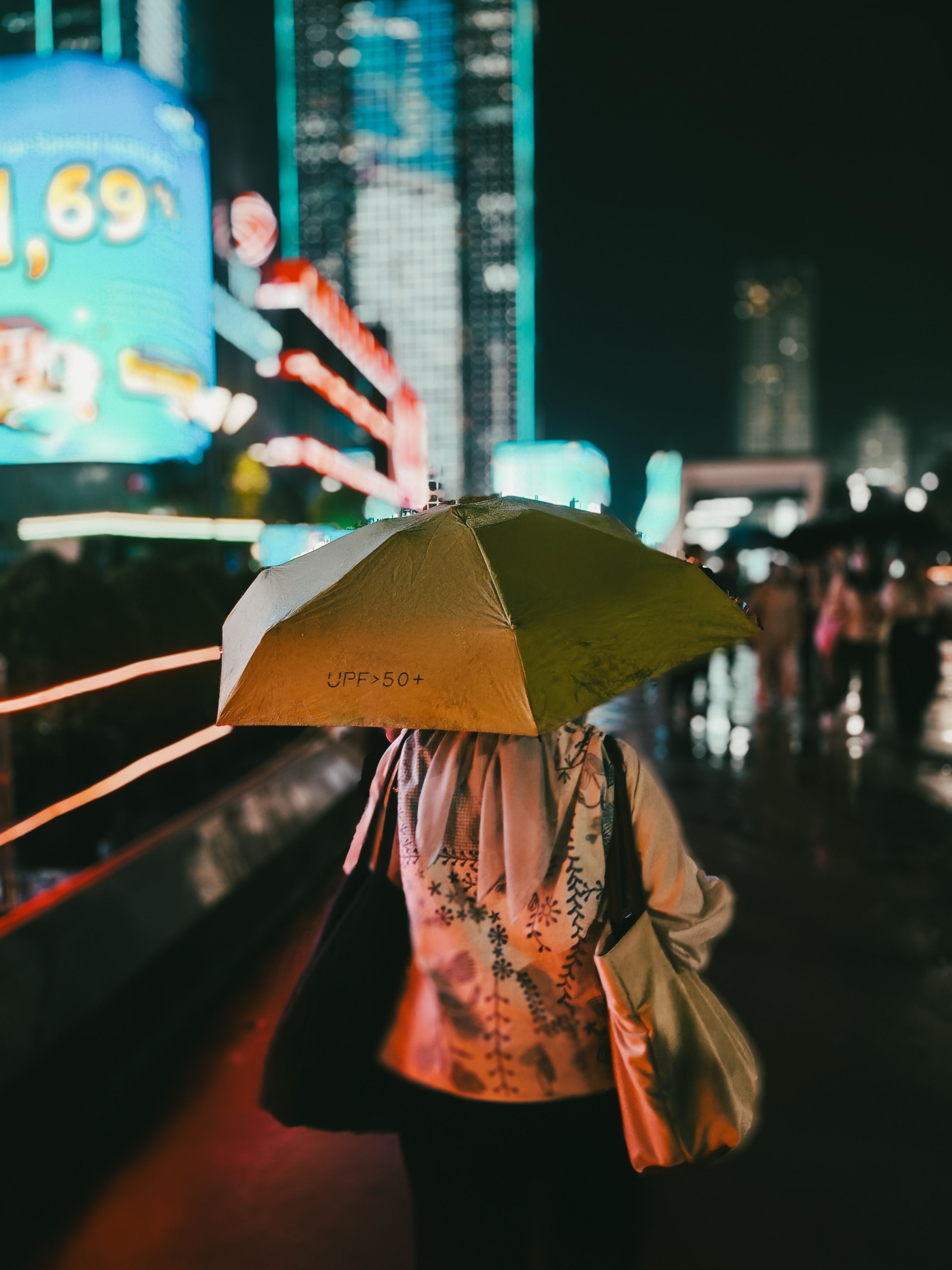 Night Street Scene with Neon Lights and Umbrella · Free Stock Photo