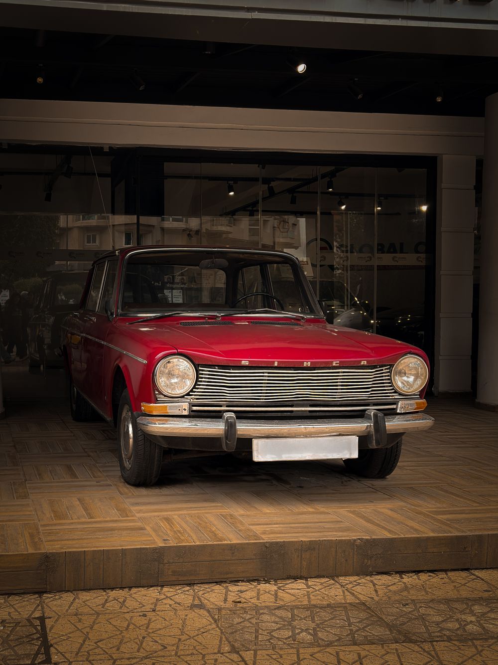 Red vintage car in a showroom