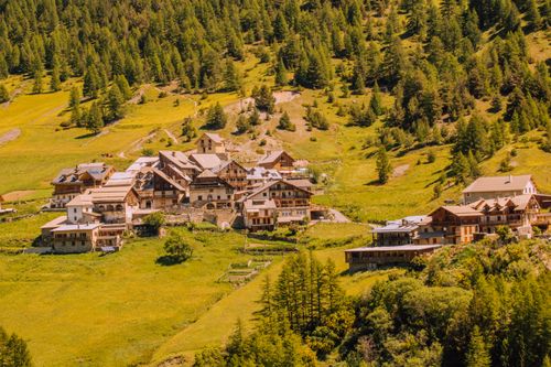Free Charming mountain village nestled in lush summer greenery in Cervières, France. Stock Photo