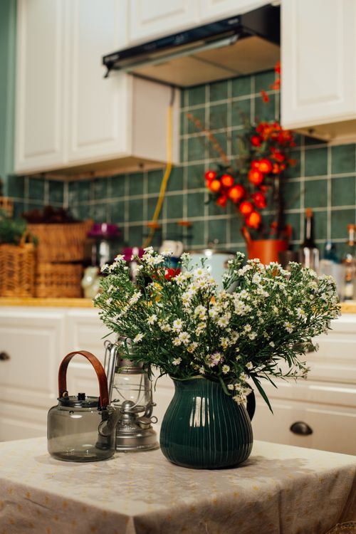 Free Aesthetic kitchen still life showcasing a bouquet of wildflowers on a table. Stock Photo
