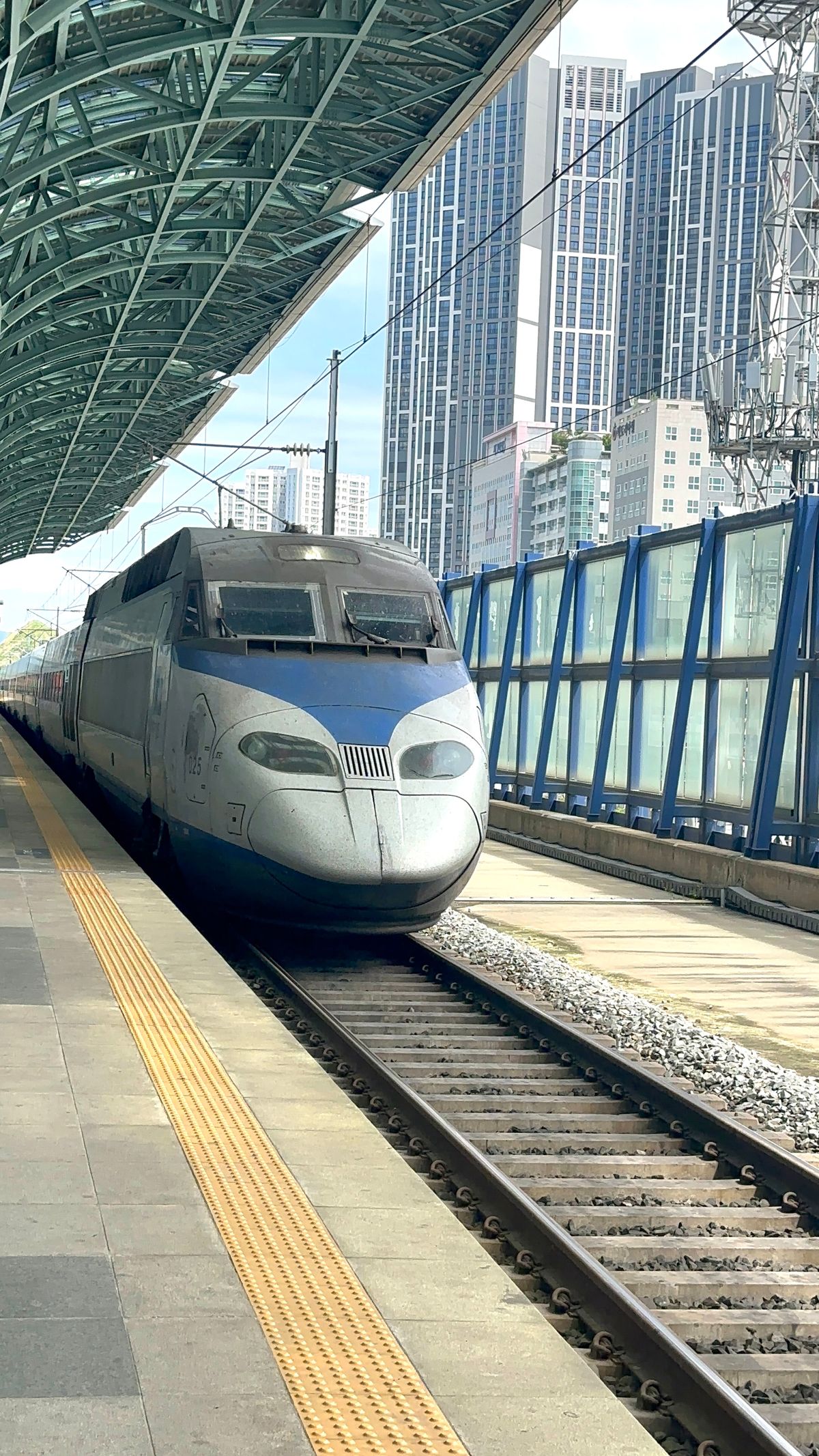 High-speed train at an urban station platform in South Korea