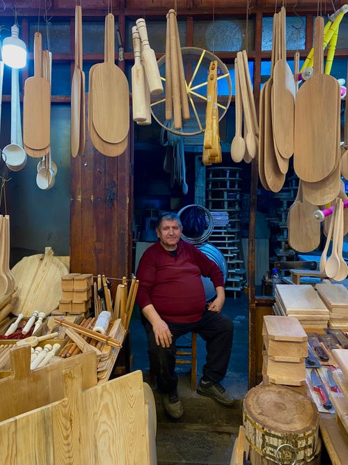 Free Explore the artisanal craftsmanship of a woodworker in a traditional Gaziantep shop displaying wooden utensils. Stock Photo