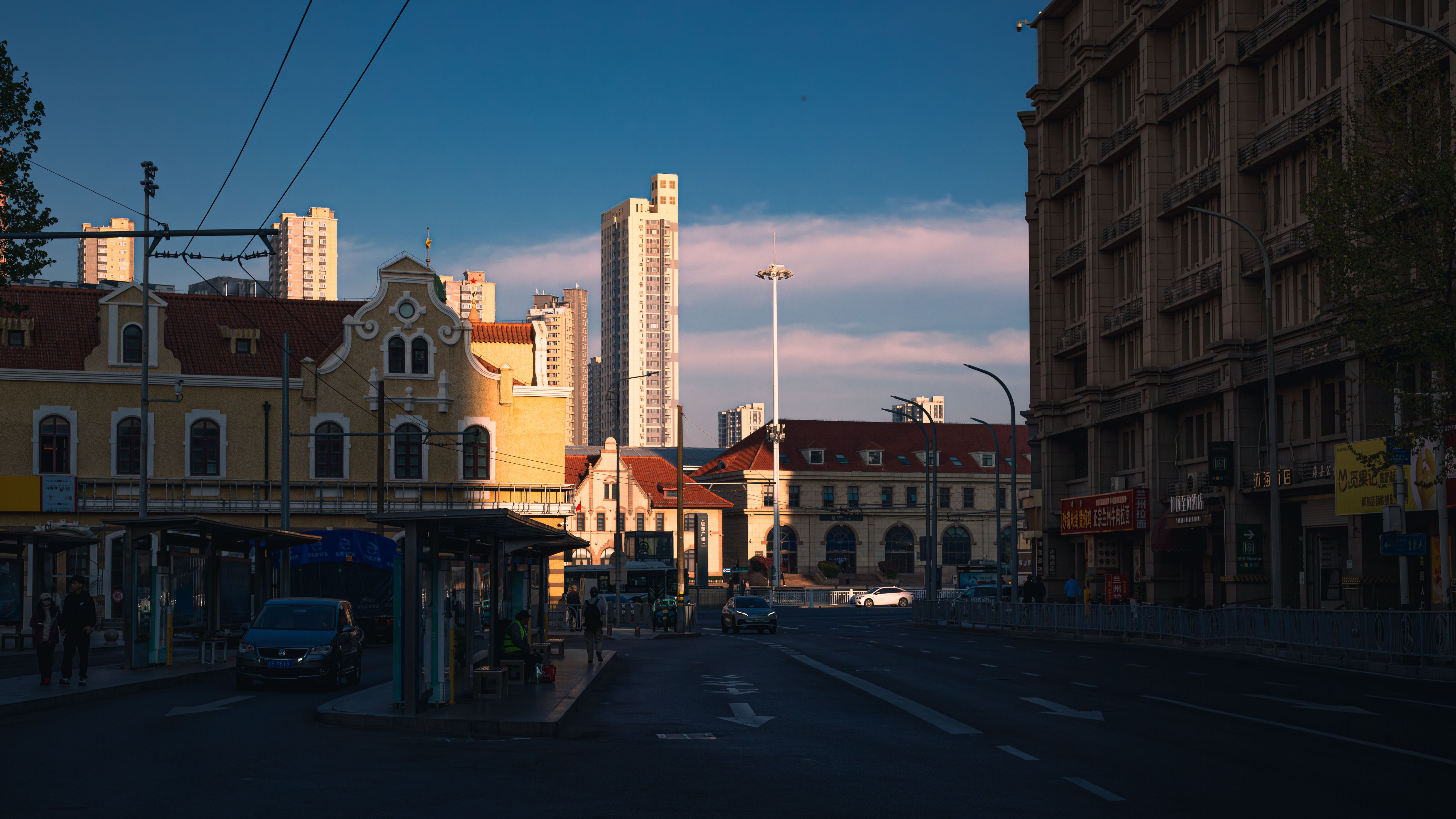 bus stop city skyline at dusk