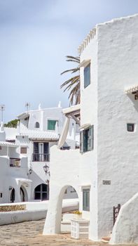 Whitewashed homes in Binibeca, Spain, showcase Mediterranean charm.