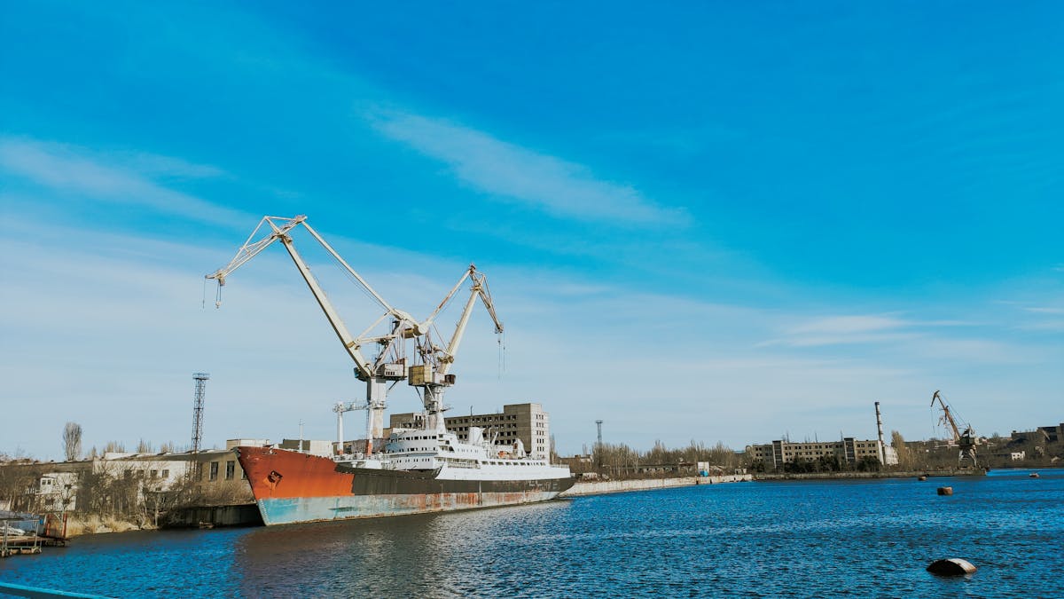 Iced matcha latte served in a tall glass with ice cubes and a green gradient
