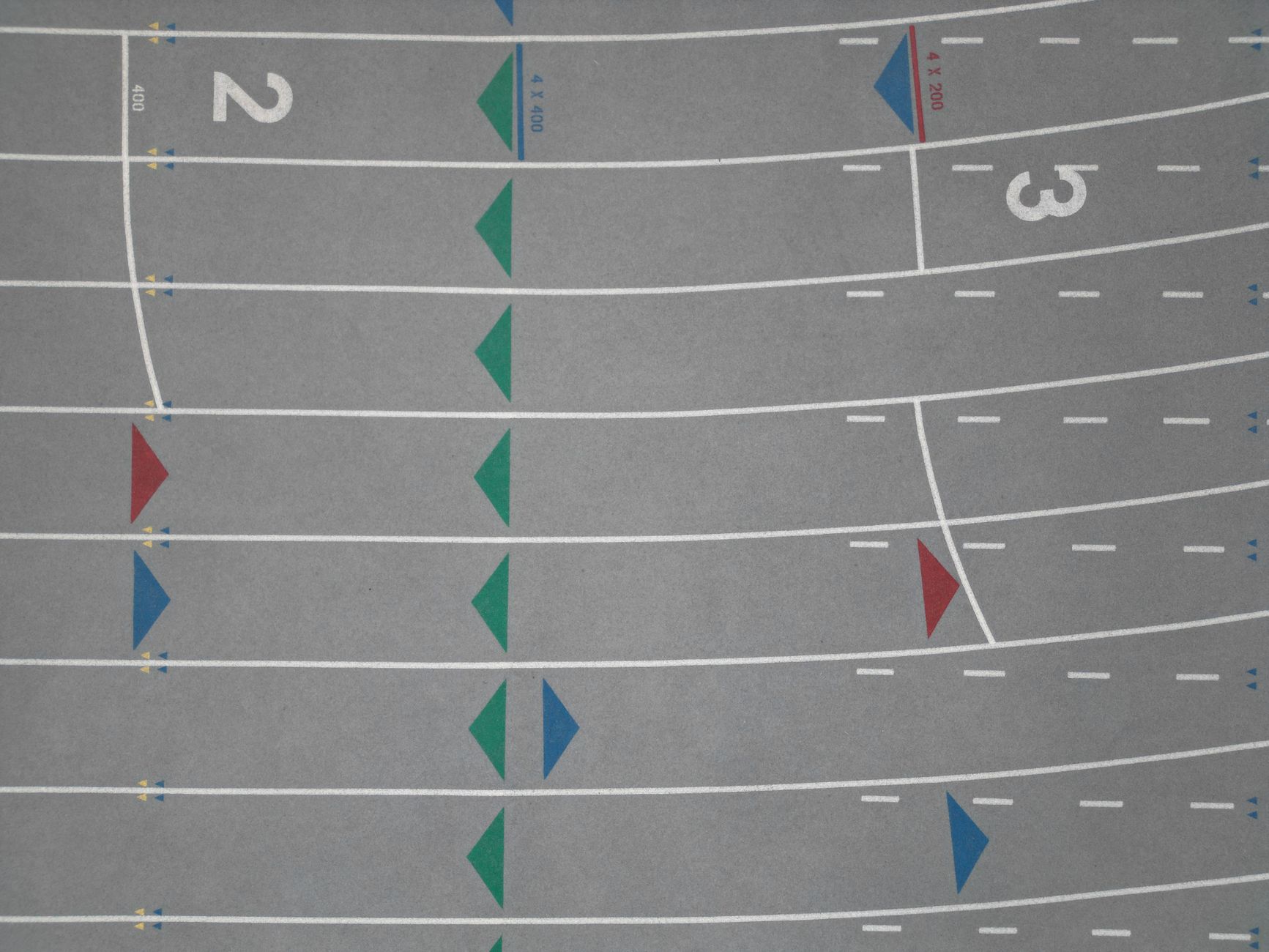 Top view of colored lanes on a track, ideal for sports and fitness themes.