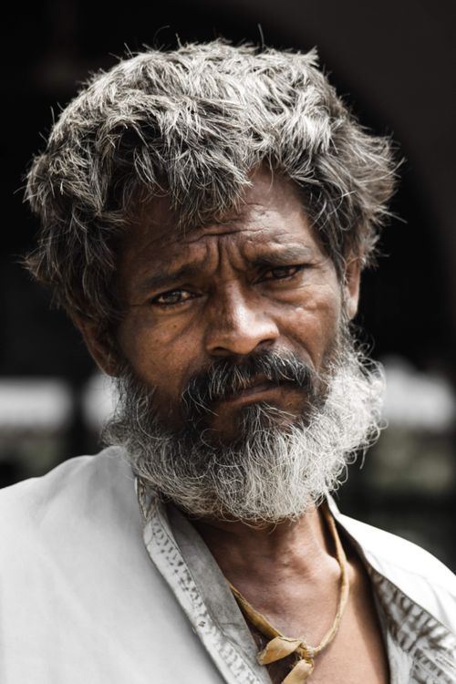 Free Close-up portrait of an elderly man with a contemplative expression in Karachi, Pakistan. Stock Photo