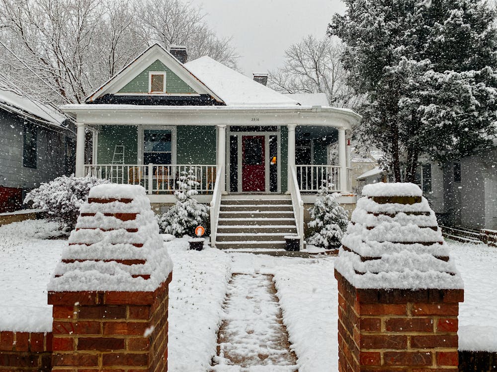 Free  Snow Covered Wooden House Near Trees Stock Photo