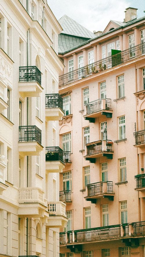 Free View of historic buildings with ornate balconies in Warsaw, Poland. Stock Photo