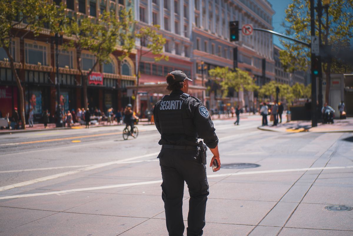 Security officer patrolling a city street