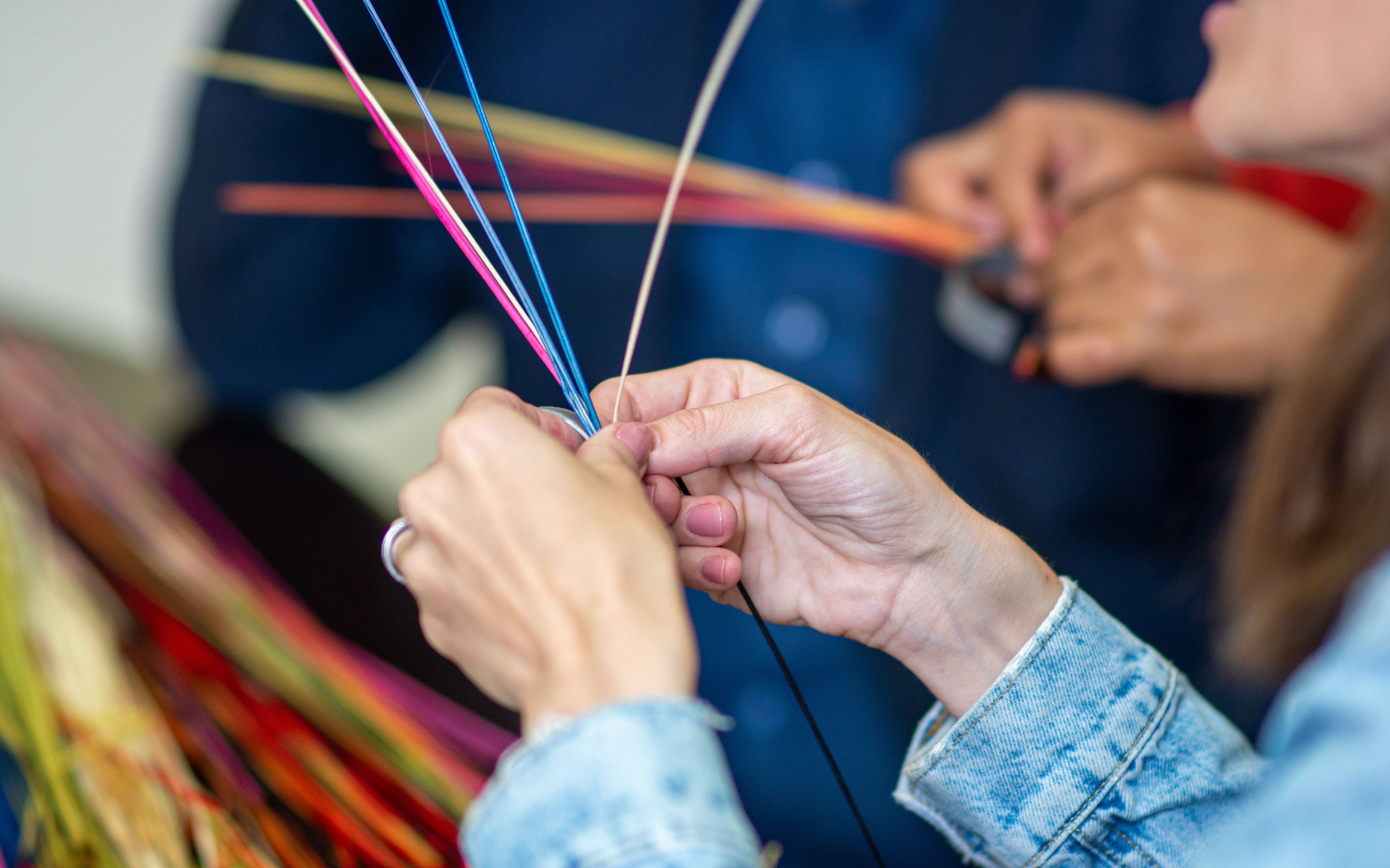Hands Crafting Colorful Straw Art in Piura · Free Stock Photo