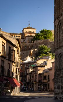 Picturesque view of historic buildings in Toledo, showcasing Spanish architecture under a clear blue sky.