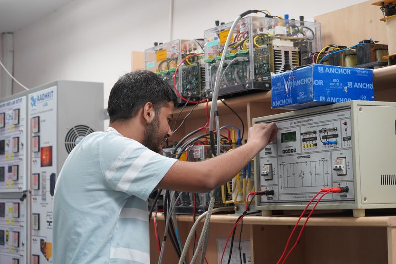 International students working together in a university engineering laboratory.