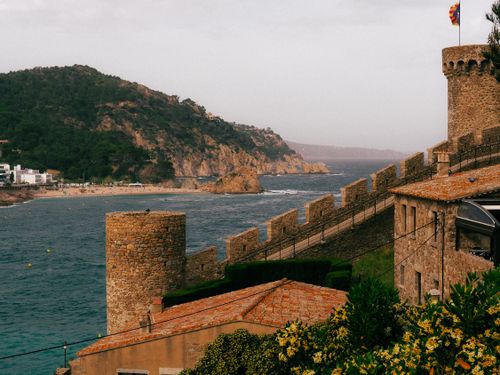 Free Explore the stunning coastal scenery and historic castle towers of Tossa de Mar, Spain. Stock Photo