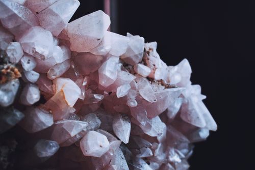 Free Detailed macro shot of rose quartz crystals showing natural beauty and texture. Stock Photo