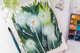 Watercolour dandelion study with brushes and palette — photo by Anna Krupa on Pexels