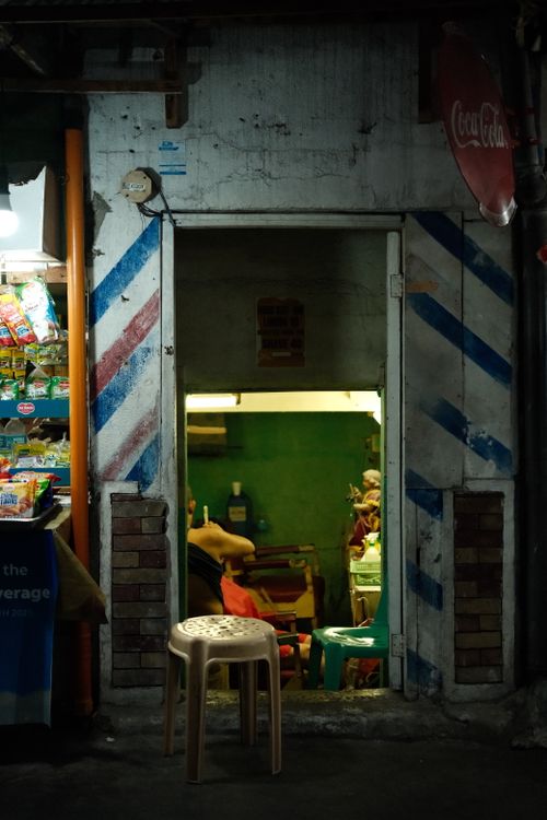 Free A quaint and traditional barber shop in Manila, showcasing local culture. Stock Photo