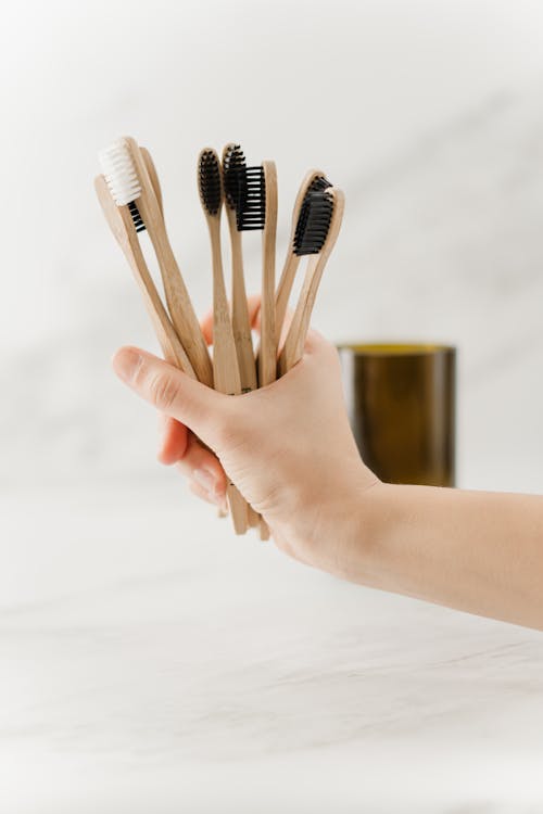 Free Person Holding Brown Wooden Toothbrush Stock Photo