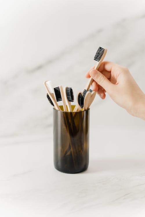 Free Person Holding Wooden Toothbrush Stock Photo