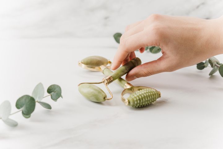 Applying a face mask with a brush in a calm skincare routine