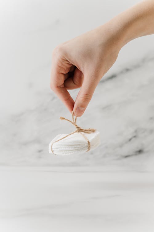 Person Holding a Bamboo Makeup Removal Pads