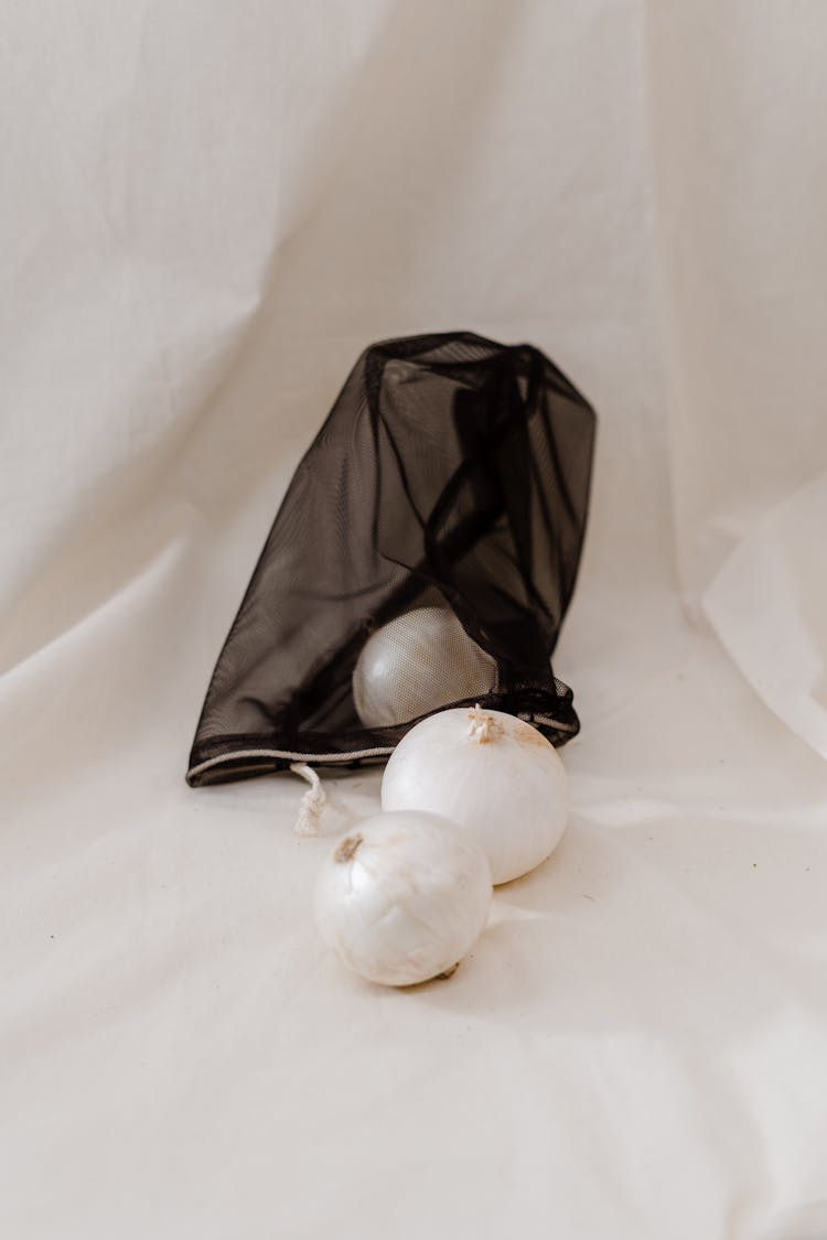 Onions Near Black Cloth Bag