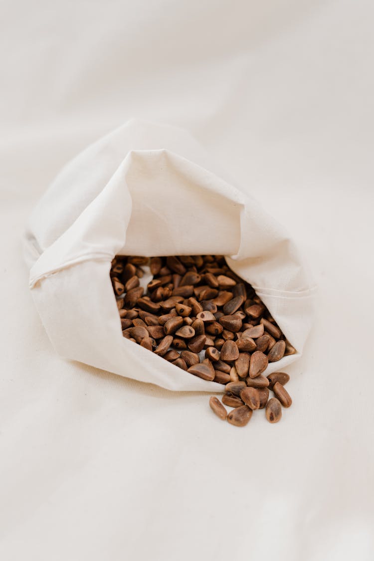 Brown Coffee Beans In White Cloth Bag