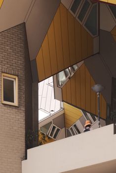 A unique view of modern cube houses with geometric shapes and muted colors, showcasing architectural innovation.