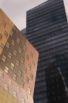 Striking view of modern skyscrapers with glass and metal facades in a city setting, showcasing urban architecture.