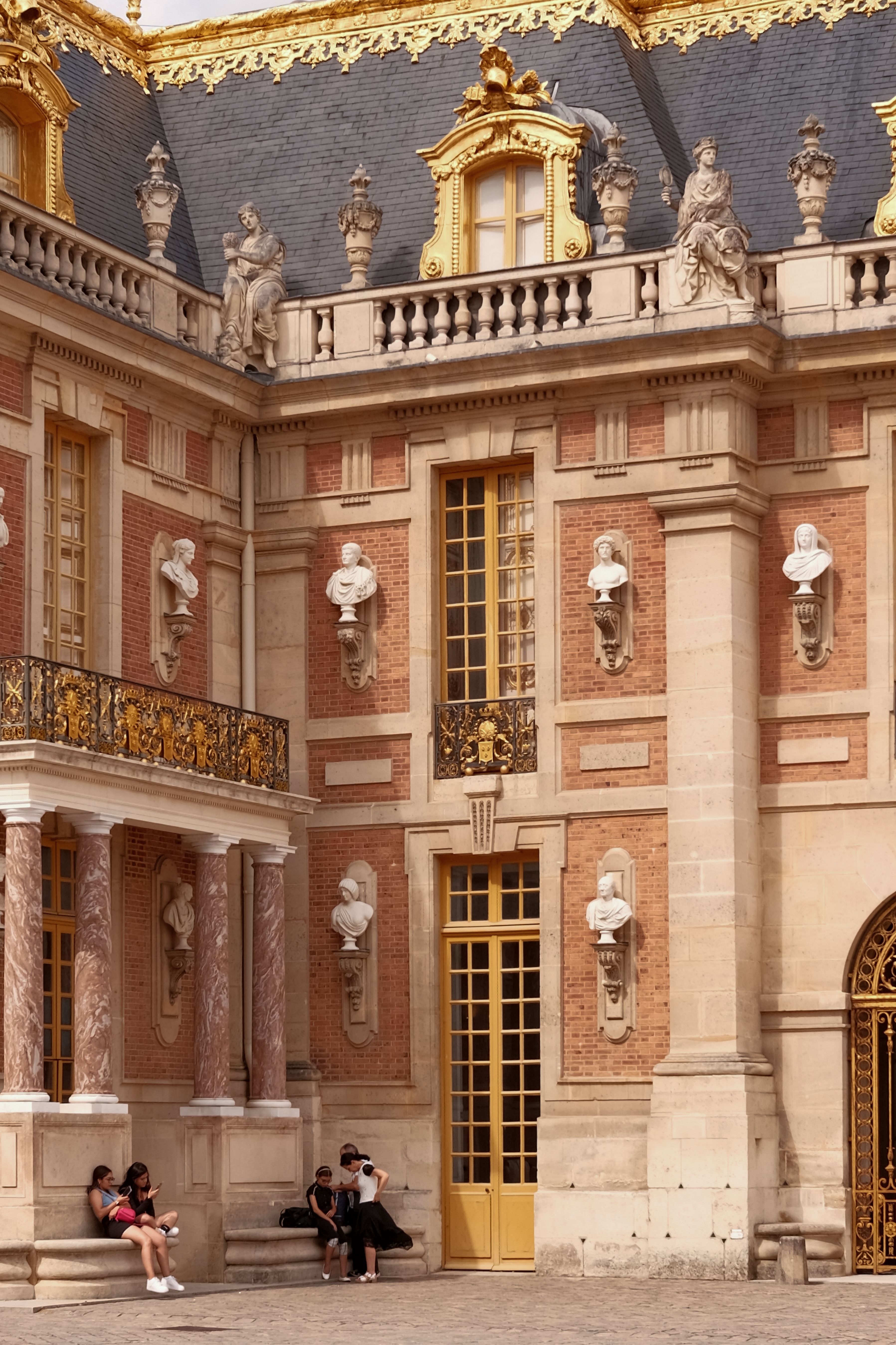 Stunning Baroque architecture at the Palace of Versailles, featuring intricate details and sculptures.