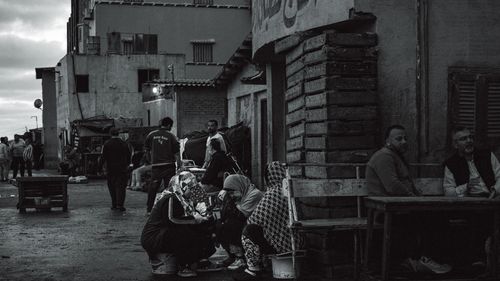 Free Monochrome image capturing daily life in a bustling urban setting. Stock Photo
