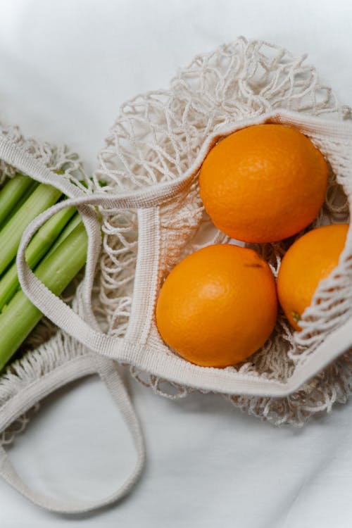 Orange Fruit In White Net Bag