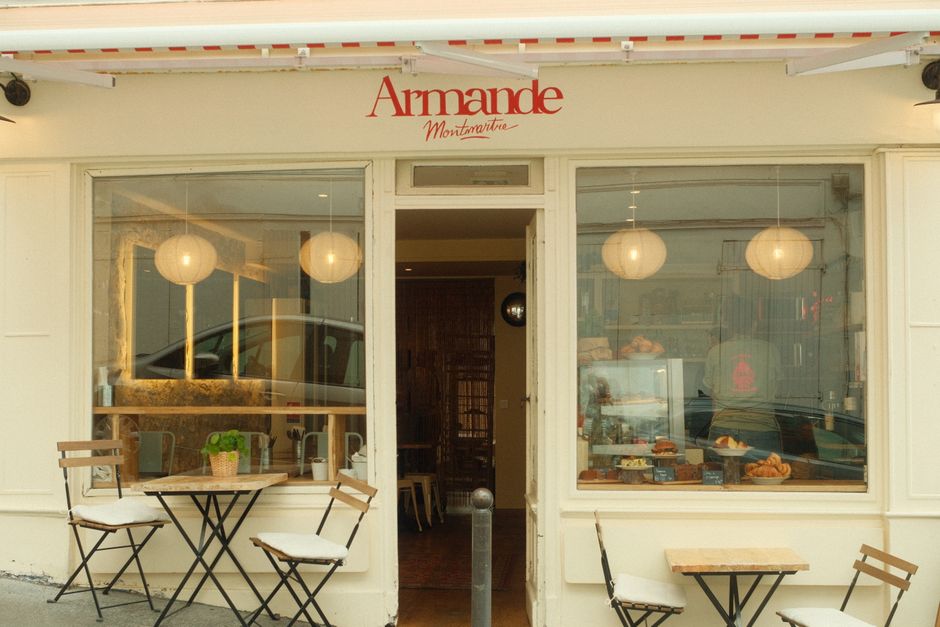 A charming Parisian cafe with outdoor seating and a classic awning