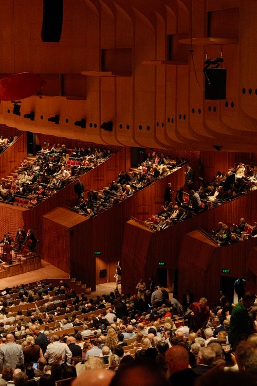 Free A bustling view inside the iconic Sydney Opera House during a concert event. Stock Photo