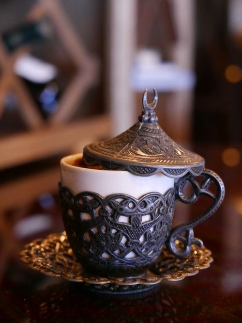 Free Ornate Turkish coffee cup with intricate metal design, elegant and cultural. Stock Photo
