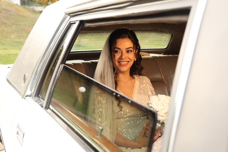 Wedding Limo Bride holding bouquet inside Toronto wedding limo white stretch limousine